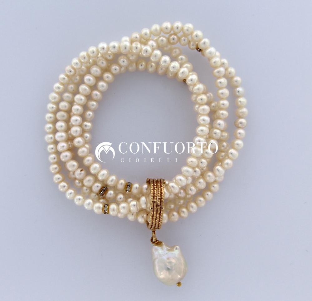 BRACCIALE ELASTICO 5 FILI IN PERLA BIANCA CON ANELLO IN ARGENTO 925%